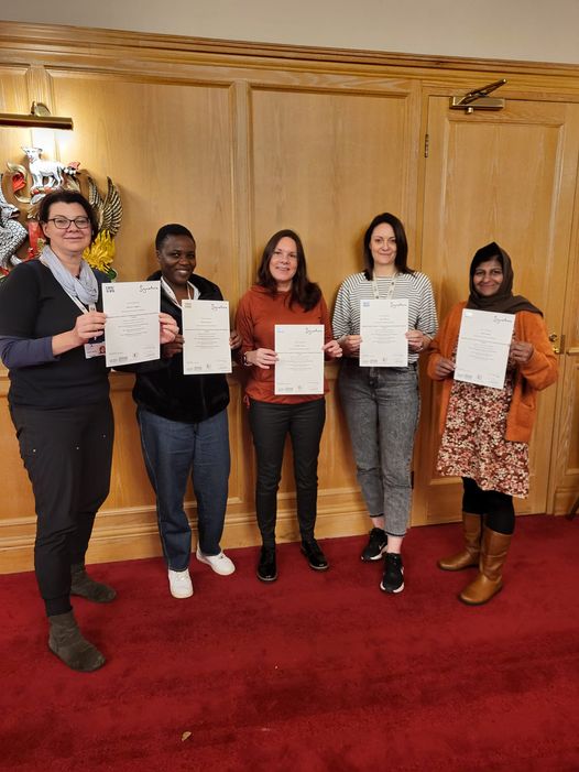 Coventry Health and Social Care workers holding their certificates