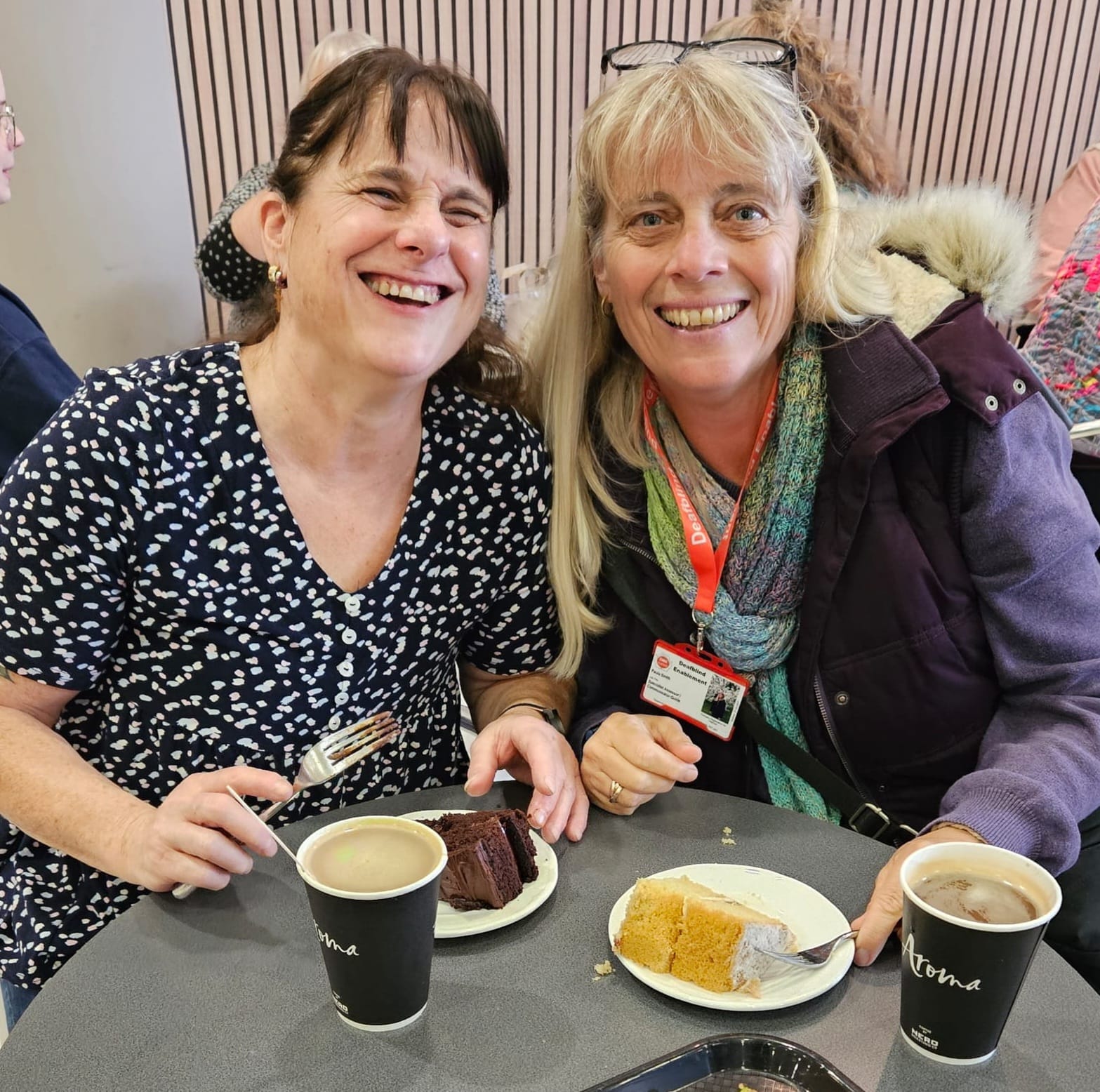 Paula and Julia having a great time with a coffee